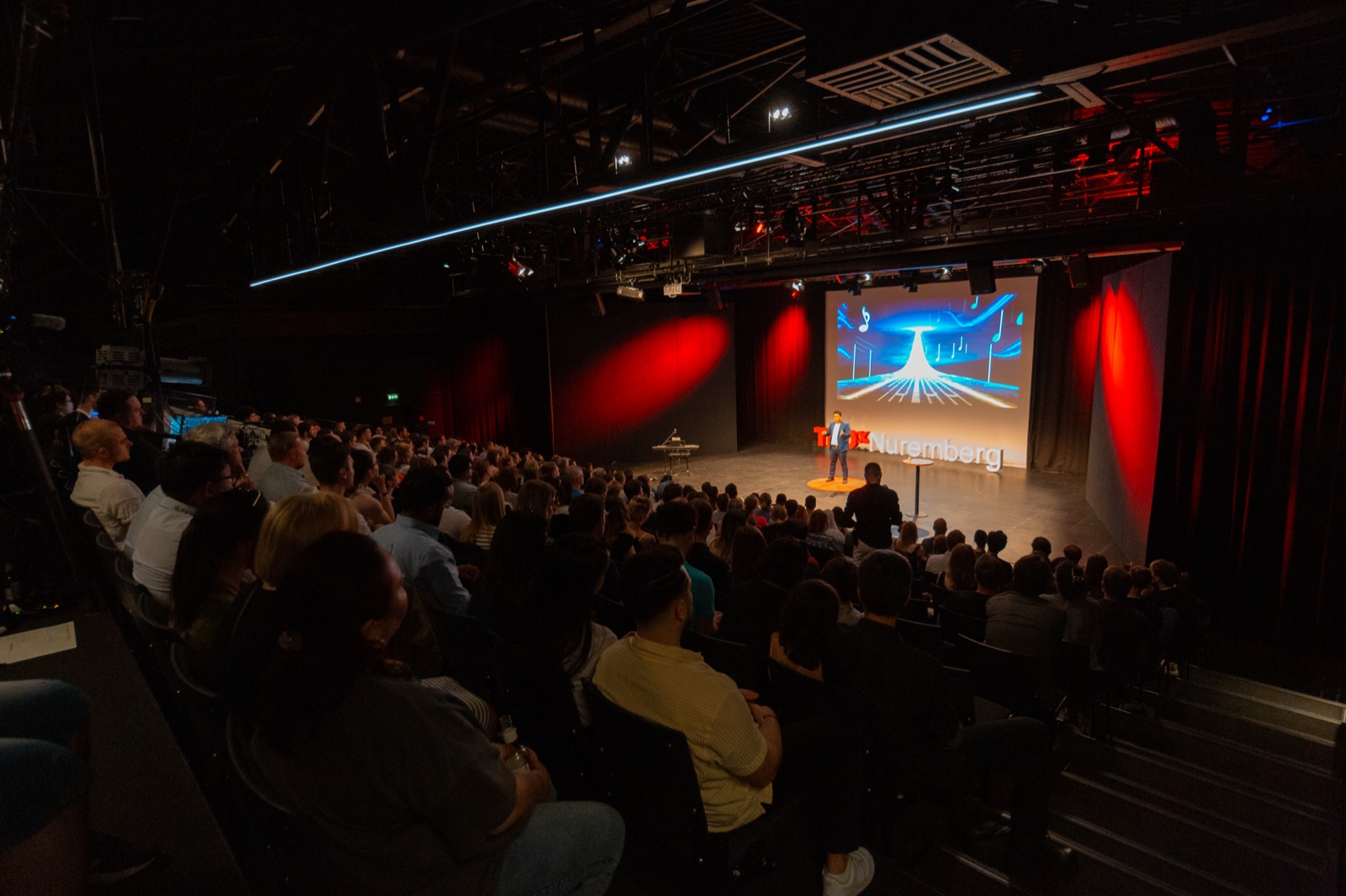 Tiankai Feng speaking on the TEDxNuremberg stage